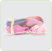 Folded pieces of pink and white Warp Knit Fabric on display